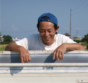 筆者（62歳）。oryza farm株式会社代表。青年海外協力隊で農業指導後、29歳で家業を継ぐ。イネオタクとして200以上の品種を育てる（現2025年2月号p164参照）